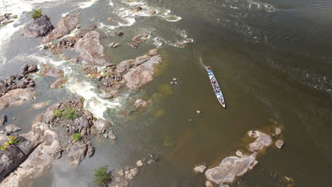Vertical-drone-view-motorised-canoe-rapids-in-saut-Maripa-French-Guiana-Brazil